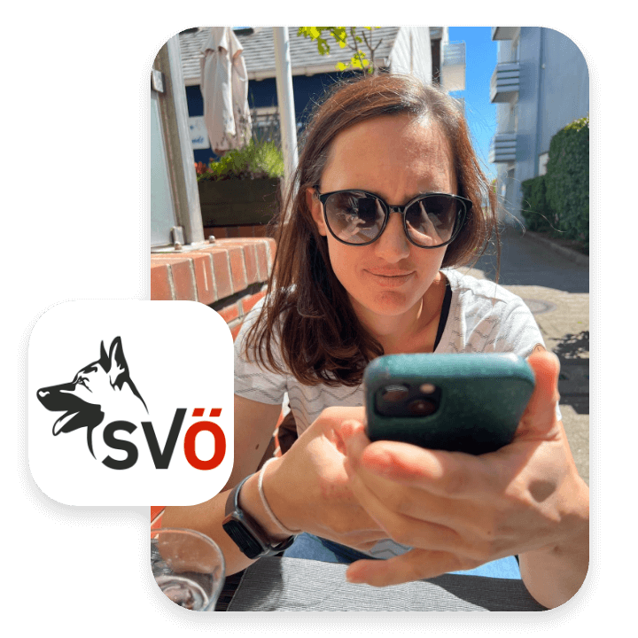 Picture of Lilly from the Austrian dog association SVÖ using kula on her phone to manage their app.
